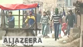 Protesters and police clash in Kashmir