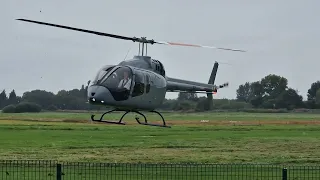 Helicopter landing at Barton Aerodrome in the rain