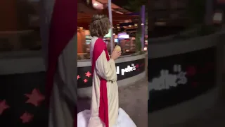 'Thank You Jesus!': Man Dressed as Jesus Gives Bread to Man in Need