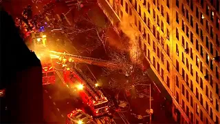 Firefighters battle heavy blaze at high-rise building in NYC