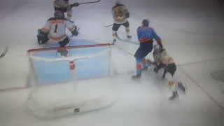 Charlie McAvoy gets injured crashing into the boards from a puck battle with Carter Verhaeghe