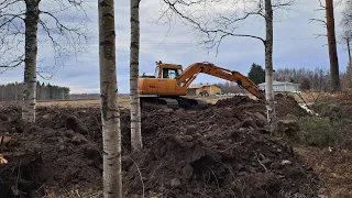 Järvenrantamaisemaa Hyundai robex 130 ja lehtijuttua