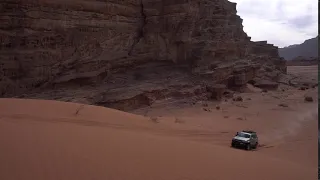 Riding a huge dune on the way to Wadi Rum