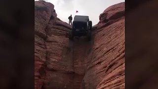 Jeep Defies Gravity on a Vertical Cliff