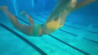 Woman playing underwater