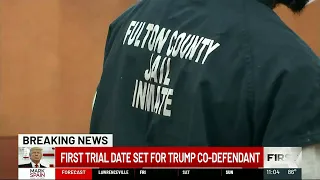 First trial date set for Trump co-defendant