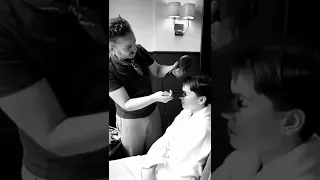 Daisy Ridley getting her hair done for the 2022 BAFTA Awards