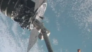 Astronauts grab cargo from space with robotic arm