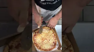 Pizza cut in 12 for the school kids making it look easy all day ￼