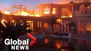 Coastal fire burns through Southern California, destroying at least 20 homes