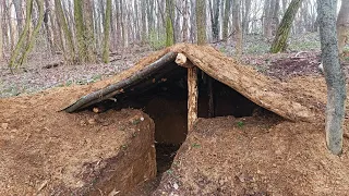 A man built a shelter in the forest