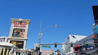 The Las Vegas Strip Walking Tour on 4/9/23 around 12pm in 4k with blue skies and showgirls.
