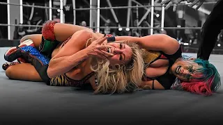 Asuka brutalizing Charlotte Flair