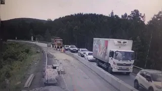 Truck plows through traffic in Russia after apparent brake failure.