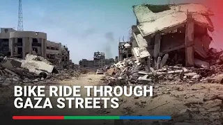 Bicycle ride through the streets of Gaza shows extensive damage caused during war | ABS-CBN News