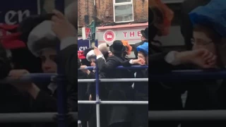 Tottenham fans celebrating victory over Millwall - Jewish celebrating Purim in Dalston
