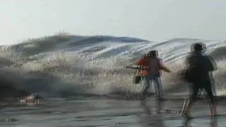 Giant wave crashes onlookers