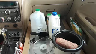 Cooking in the car, with rice cooker.