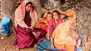 nomadic life;  Nargis and her helpless daughters in front of the rain