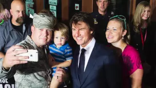 Tom Cruise greets fans at a benefit showing of his new film