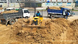 New Project, Power Komatsu D31P Bulldozer Push The Soil Well And Mini Dump Trucks Unloading Soil