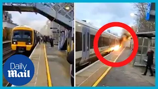 Terrifying moment passengers flea train catching fire