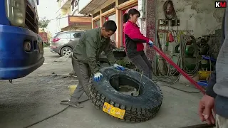 Chinese couple install new tires for the truck