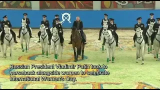 Russia's Vladimir Putin on horseback for women's day event