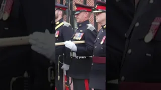 The Queen giggles with Canadian officer