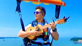 Singing "Somewhere Over The Rainbow" while Parasailing