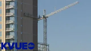 Two rescued after scaffolding malfunction at construction site off I-35 | KVUE