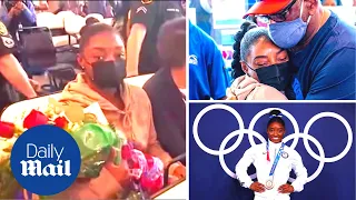 Simone Biles arrives back in the US to rapturous welcome after Tokyo Olympic Games