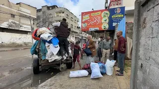 People prepare to leave after Israeli military orders evacuation of parts of Rafah