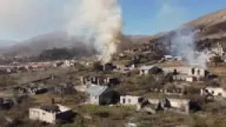 Fleeing Nagorno-Karabakh residents burn own homes