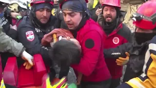 WARNING: GRAPHIC CONTENT - Woman, child pulled alive from Turkey quake wreckage