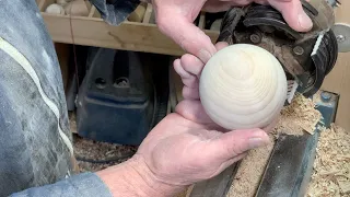 Richard Raffan turns a claret ash ball