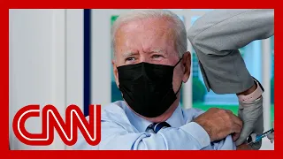 See Biden get his Covid-19 booster shot while talking to the press