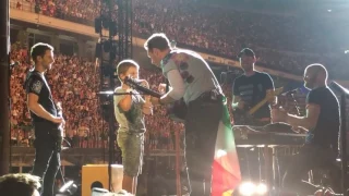 Coldplay and a 9-year-old boy perform Don't Panic (with harmonica)