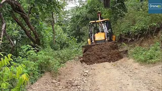 JCB Backhoe Loader-Leveling Hilly Damaged Road