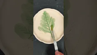 Creating a Christmas tree ceramic dish with a fern leaf imprint in clay #vuvuceramics #ceramics #art