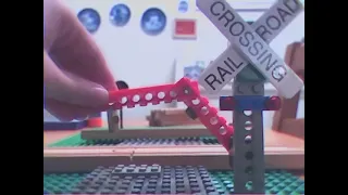 Double hinged lego railroad crossing gate