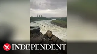 Water rushes over destroyed Ukrainian dam after Russian shelling