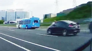 Road rage incident leaves man clinging to speeding car hood on major highway