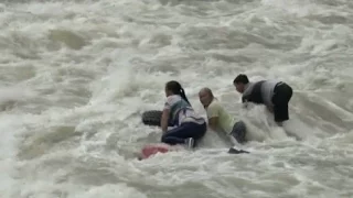 Firefighters Rescue Three from Flooded River in Southwest China