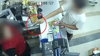 Robber with knife flees as female cashier shouts at him