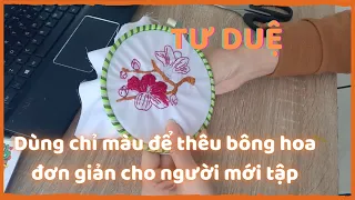 Dùng chỉ màu để thêu bông hoa đơn giản cho người mới tập