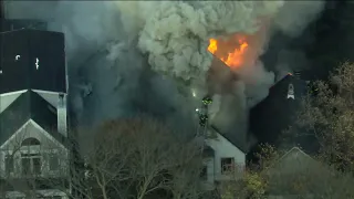 Flames force Chicago firefighters off Logan Square rooftop