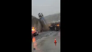 Truck tumbles over California freeway on top of pile-up