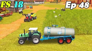 FS 18 COW FARM. Timelapse # 48. Spreading slurry with two barrels. Collecting grass and bales.