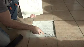 Removing popped tiles and putting them back down